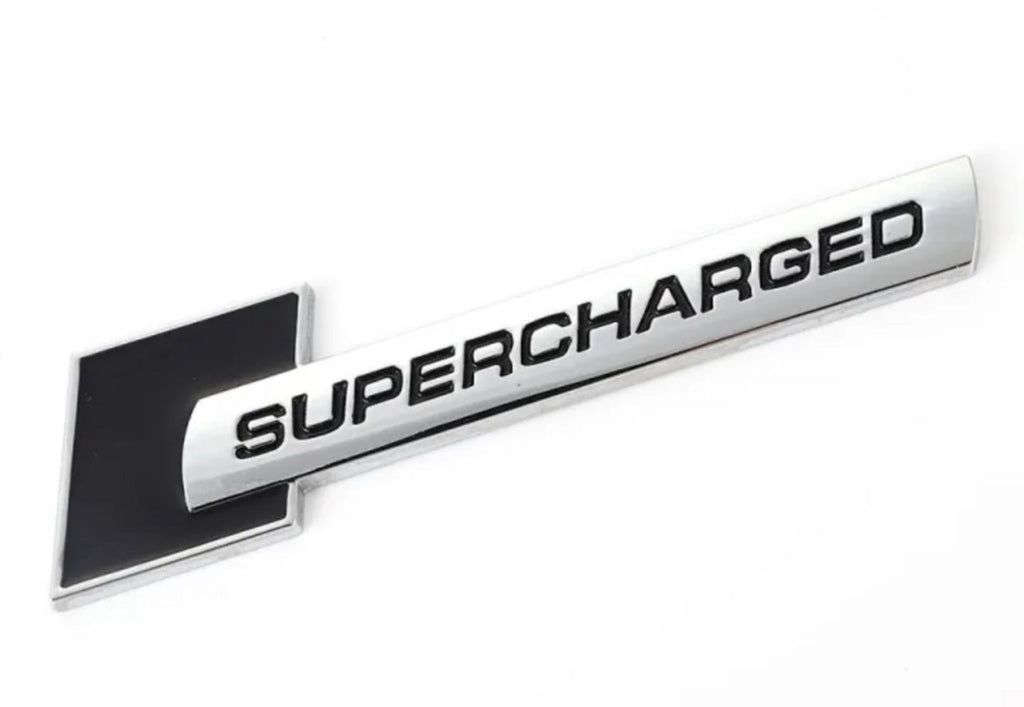 Supercharged (1PC) Logo Chrome Black. 10 x 2.6cm Car Bike Metal Supercharged Logo Car Emblem Premium 3D Badge Auto Racing Sport Sticker Grand Tourer Decal