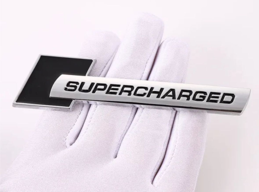 Supercharged (1PC) Logo Chrome Black. 10 x 2.6cm Car Bike Metal Supercharged Logo Car Emblem Premium 3D Badge Auto Racing Sport Sticker Grand Tourer Decal